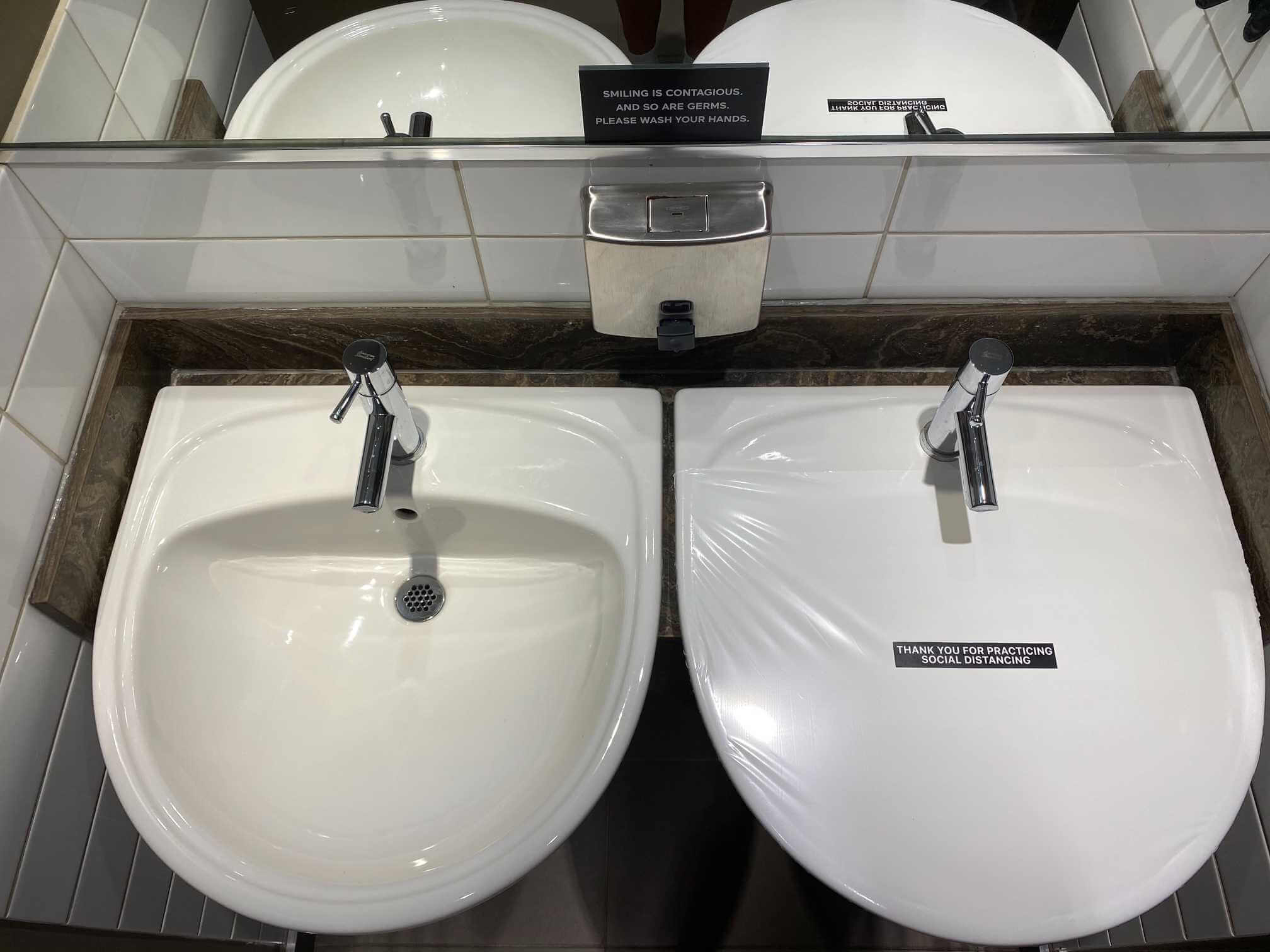 Covered out-of-order restroom fixture